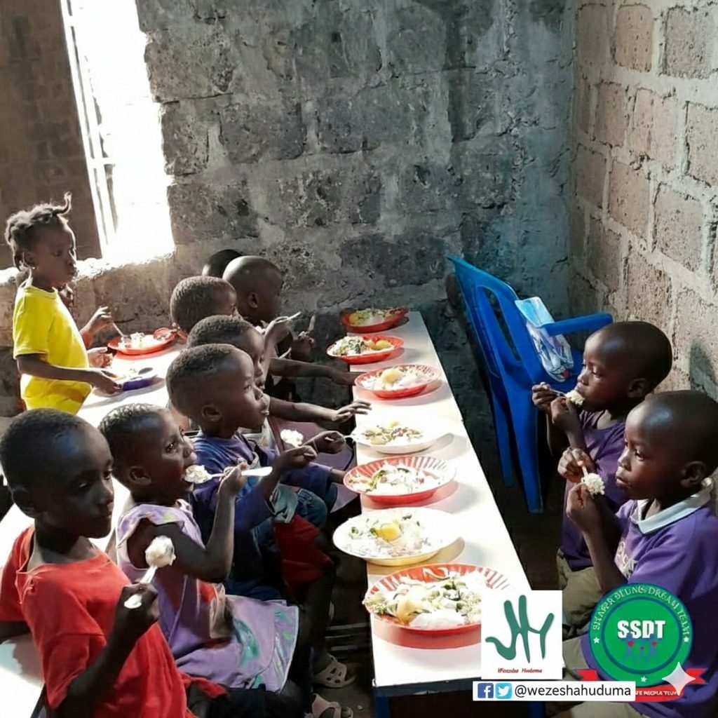 Children being served meals at a feeding program